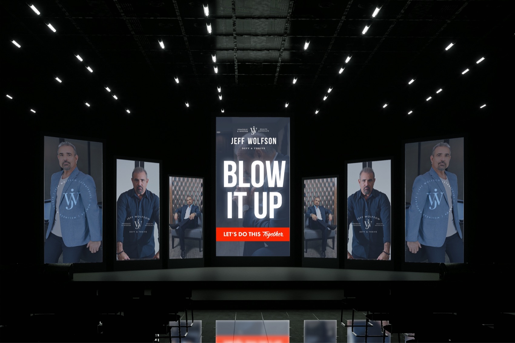 Stage with screens reading Blow It Up and portraits of Jeff Wolfson