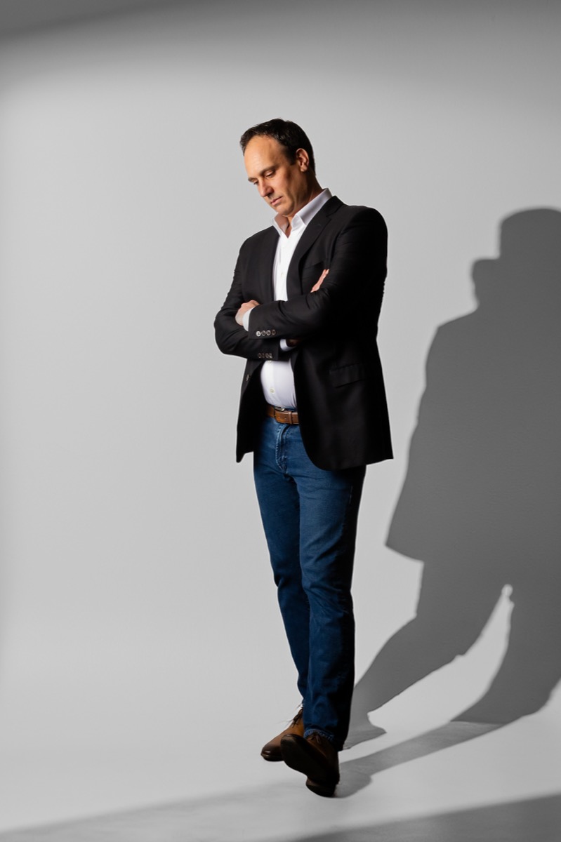 Michael Bernoff standing with arms crossed