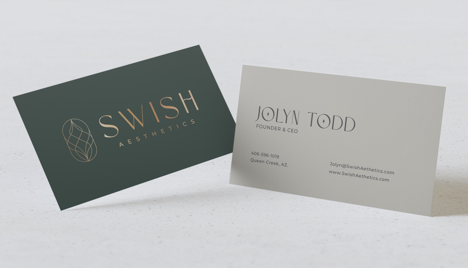 Swish Aesthetics business cards in forest green and warm grey