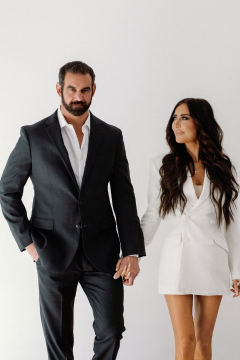 Marcus and Amber Capone walking hand in hand